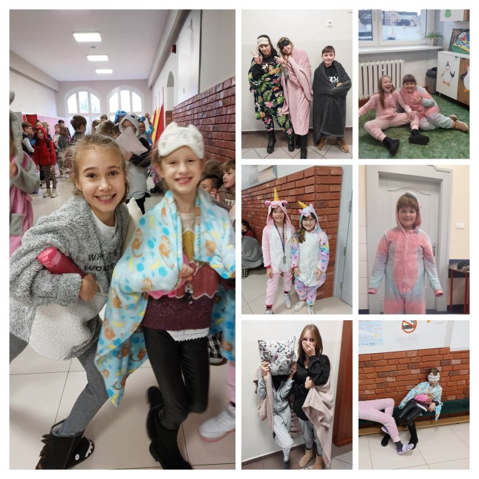 Dzieci ubrane w kolorowe piżamy uśmiechające się na szkolnych korytarzach